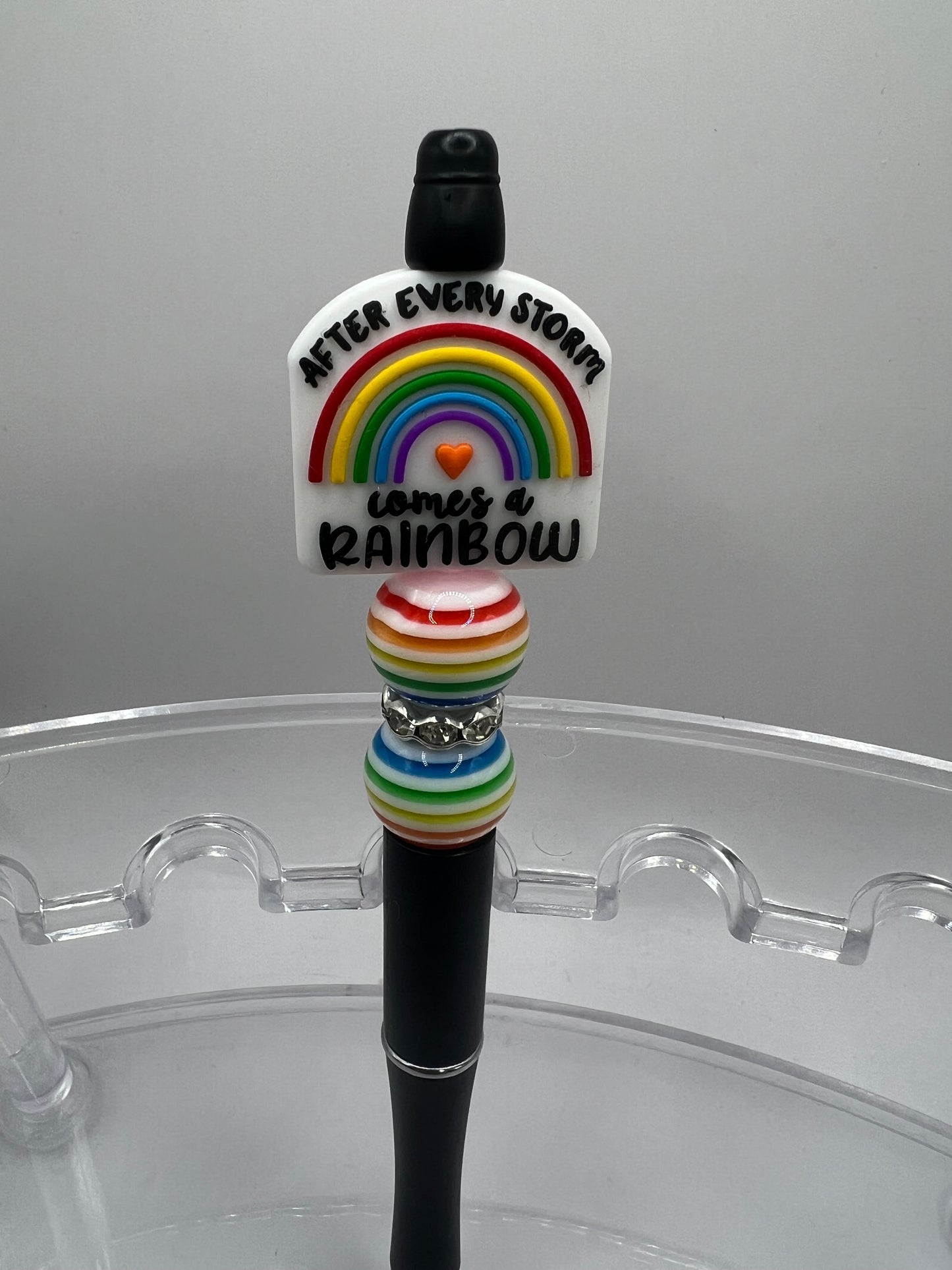 After every storm comes, a rainbow beaded pen