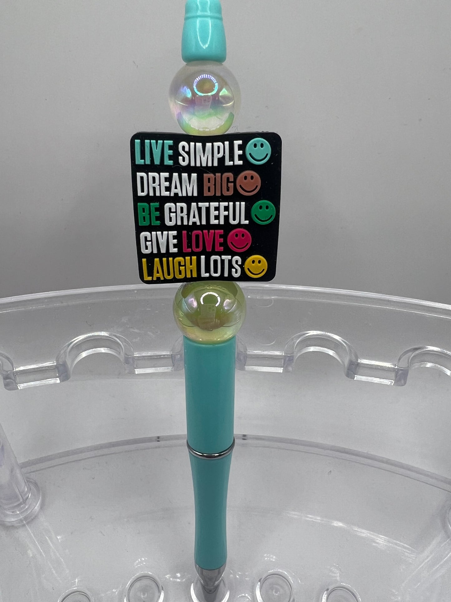 Live simple dream big be grateful give love laugh lots beaded pen